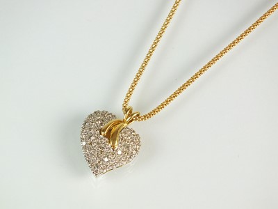Lot 77 - An 18ct gold diamond heart pendant