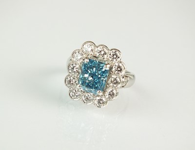 Lot 84 - A platinum fancy vivid blue coloured diamond cluster ring