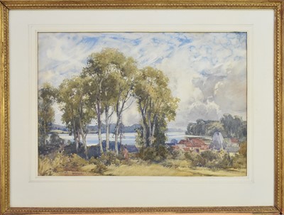 Lot 175 - George Robert Rushton (1869-1947) Lady walking amongst trees with a lakeside village beyond