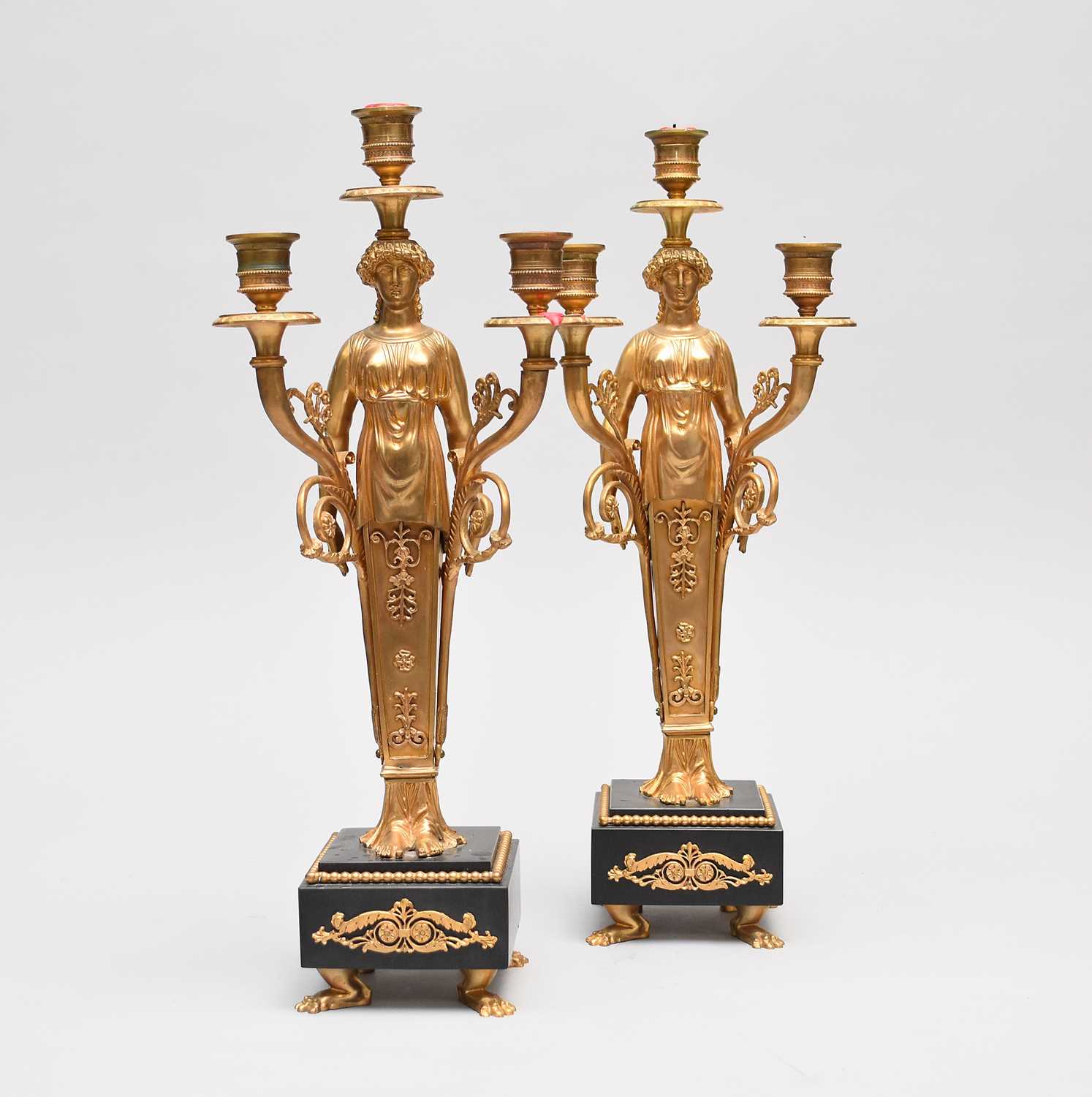 Lot 510 - A pair of good reproduction, Regency style, bronze figural candelabra