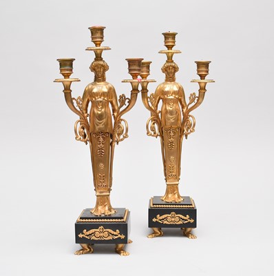 Lot 510 - A pair of good reproduction, Regency style, bronze figural candelabra