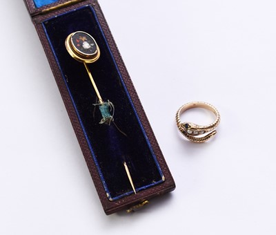 Lot 100 - A 9ct gold pearl and sapphire snake ring and a stick pin