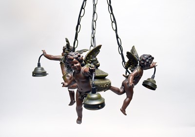 Lot 561 - A reproduction bronze effect composite figural three-branch electric ceiling light