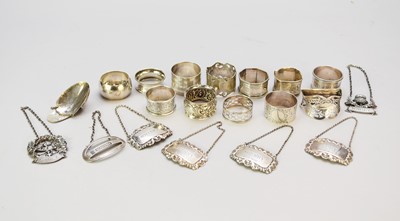 Lot 92 - A group of silver napkin rings and decanter labels