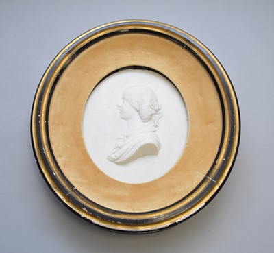 Lot 520 - A carved white marble cameo portrait of a young woman