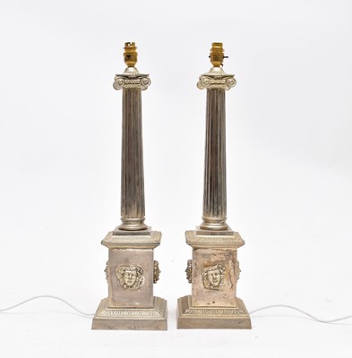 Lot 35 - A pair of imposing silver coloured ionic column table lamps