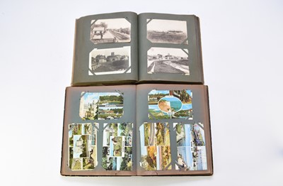 Lot 596 - A collection of postcards to two albums