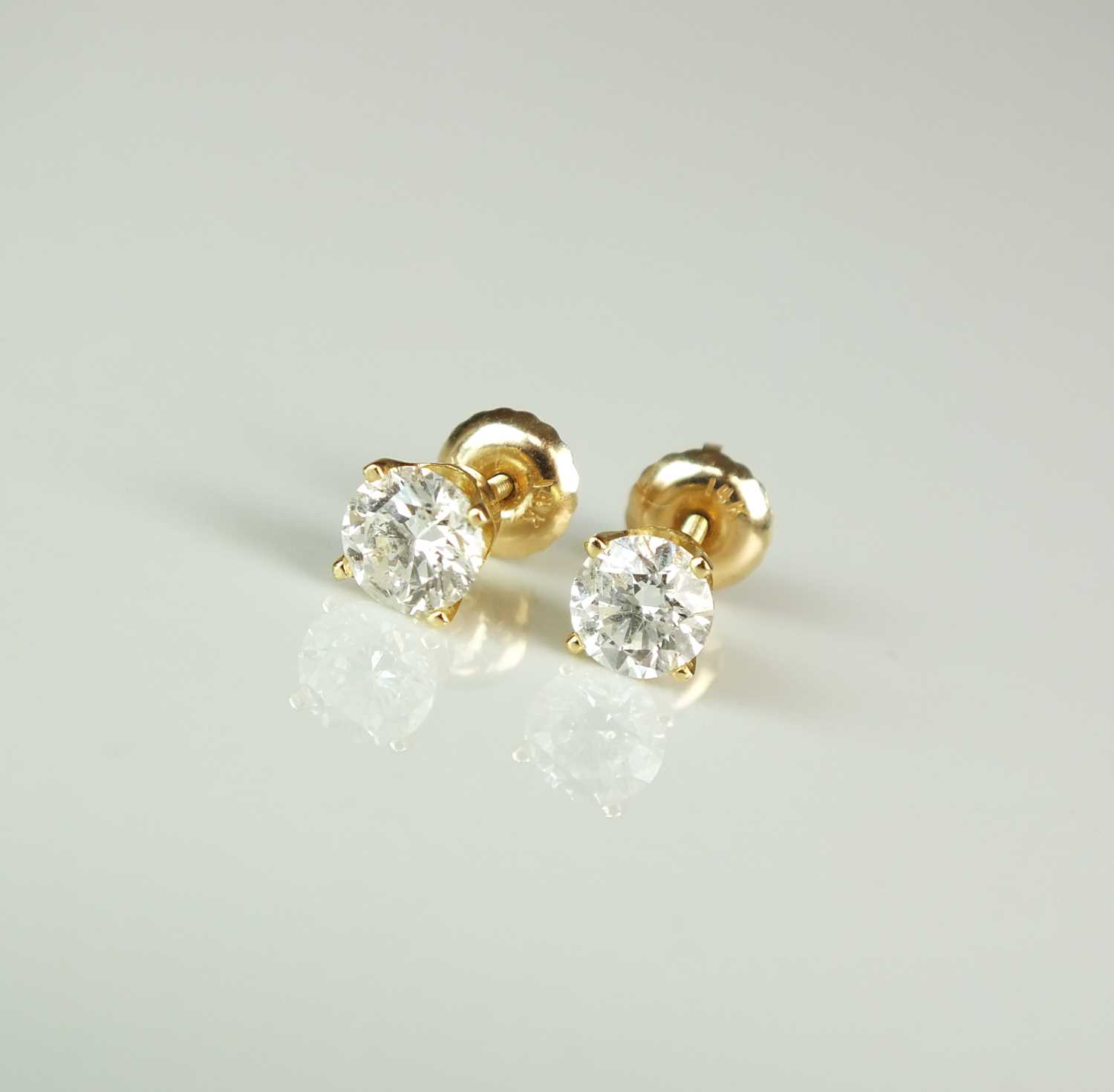 Lot 73 - A pair of diamond stud earrings