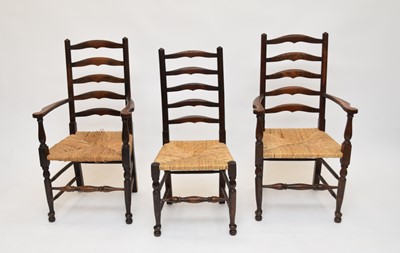 Lot 66 - A set of 8, 20th century stained ash ladder back chairs