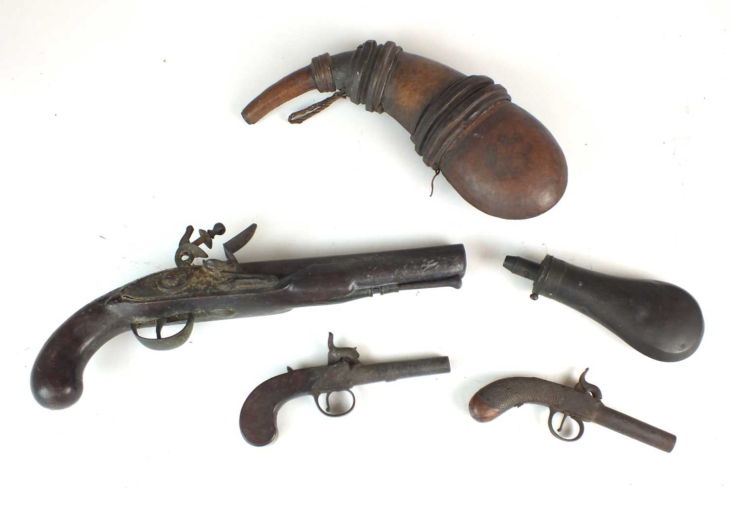Lot 30 - Two percussion pocket pistols, a flintlock pistol and two flasks
