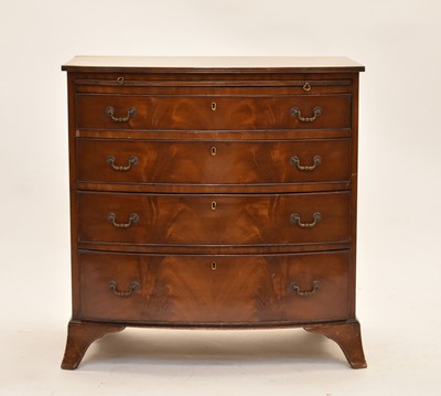 Lot 581 - A reproduction mahogany bow front chest of drawers
