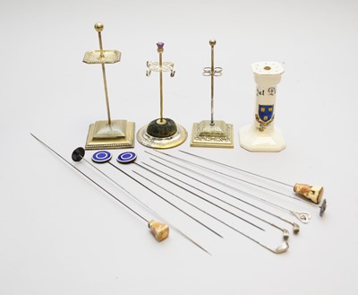 Lot 103 - A collection of hat pins and stands