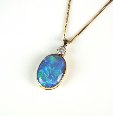 Lot 37 - A black opal and diamond pendant