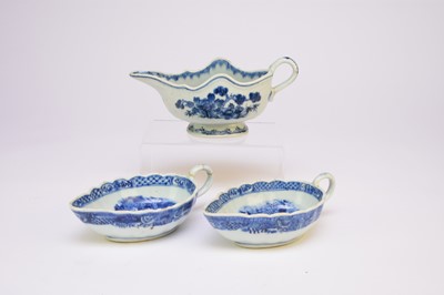 Lot 475 - Three Chinese blue and white sauce boats, 18th century