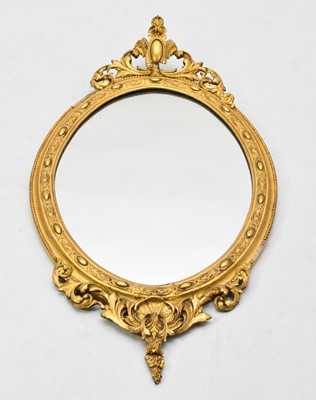 Lot 693 - A Regency revival giltwood oval mirror