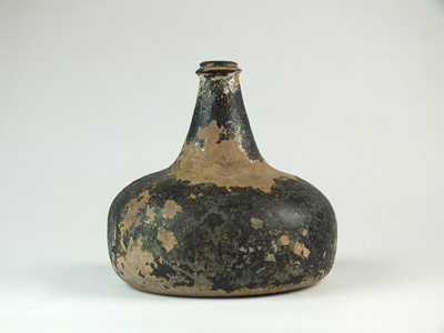Lot 161 - An early 18th century English glass onion bottle