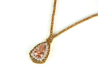 Lot 79 - An 18ct gold topaz and diamond necklace