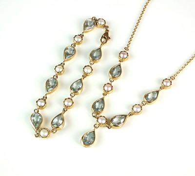 Lot 70 - A 9ct gold aquamarine and cultured pearl necklace and bracelet suite