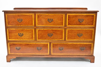 Lot 592 - A recent satinwood banded chest of drawers