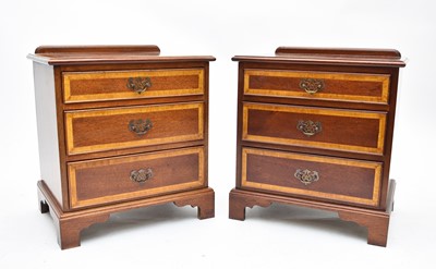 Lot 593 - A pair of recent satinwood banded bedside chests
