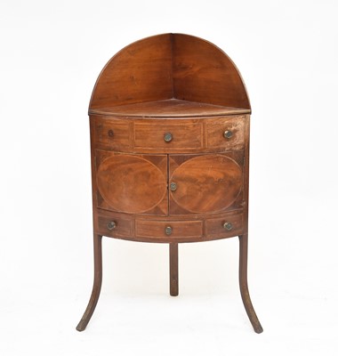 Lot 586 - A George III mahogany, bow-fronted, corner washstand