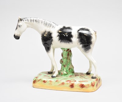 Lot 329 - Staffordshire model of a horse