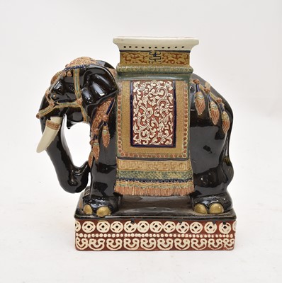Lot 395 - A 20th century Chinese ceramic garden seat in the form of a caparisoned elephant