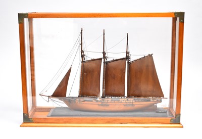 Lot 496 - A reproduction cased model ship