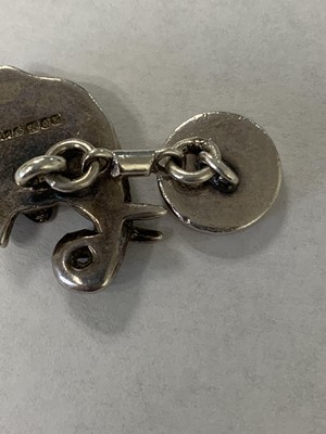 Lot 50 - A pair of Asprey silver and enamel elephant cufflinks