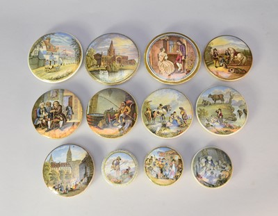 Lot 354 - A collection of twelve prattware pot lids, unframed