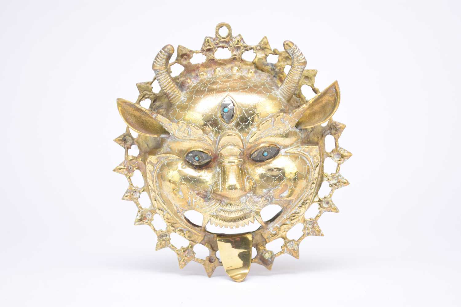 Lot 424 - A Tibetan brass Yama mask