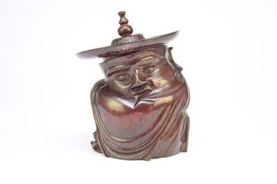 Lot 121 - A Chinese carved rosewood figural pot and cover