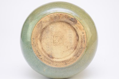 Lot 57 - A Chinese celadon glazed stoneware ewer