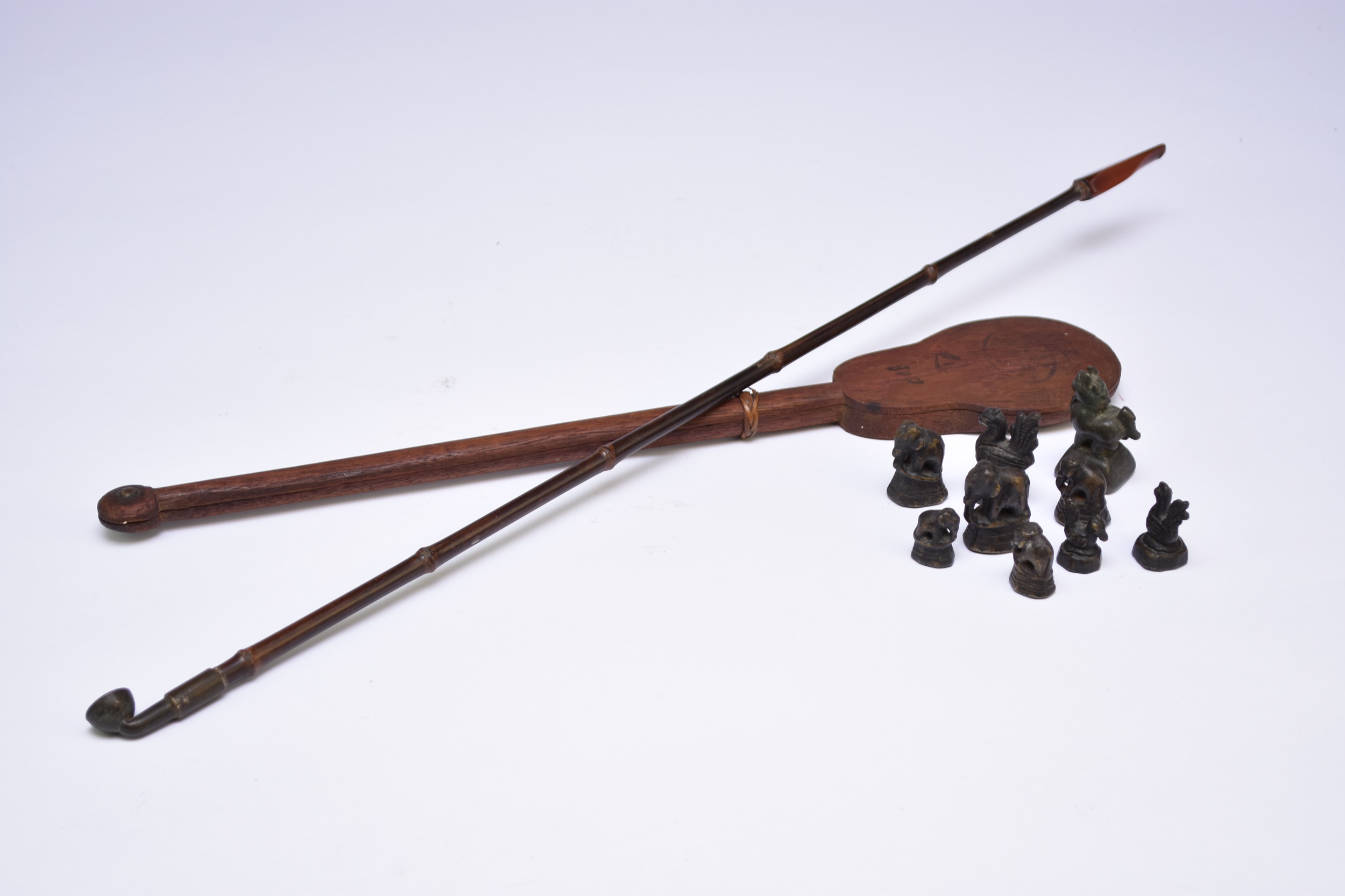 Lot 428 - A Chinese opium pipe, opium weights and a