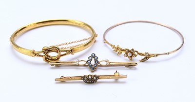 Lot 142 - Two brooches and two bangles