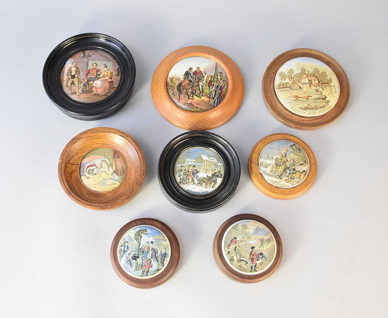 Lot 347 - Eight framed prattware pot lids including 'Hunting Bears' and 'The Bear Pit'