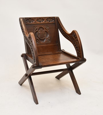 Lot 687 - A stained oak 'Glastonbury' chair, Gothic style, circa 1900