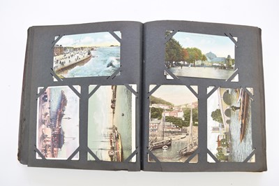Lot 1061 - TWO POSTCARD ALBUMS with 3 family photo albums, early 20th century