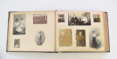 Lot 1061 - TWO POSTCARD ALBUMS with 3 family photo albums, early 20th century