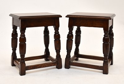 Lot 567 - A pair of Waring & Gillow oak stools