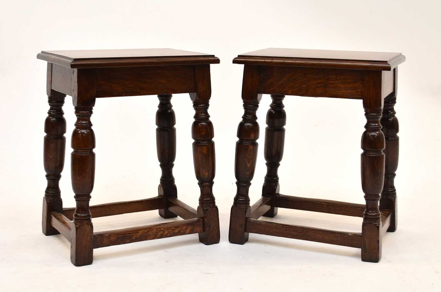 Lot 568 - A pair of Waring & Gillow oak stools