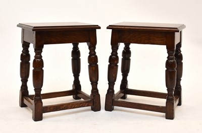 Lot 568 - A pair of Waring & Gillow oak stools