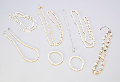 Lot 204 - A collection of cultured pearl and simulated pearl jewellery, amber jewellery and a gold crucifix