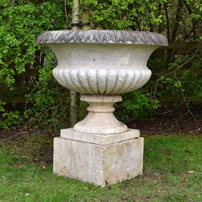Lot 46 - A late 19th century composition stone urn, on a marble socle and plinth
