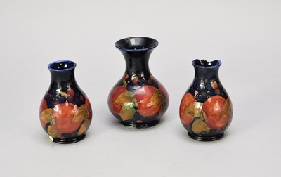 Lot 381 - Three Moorcroft 'Pomegranate' vases