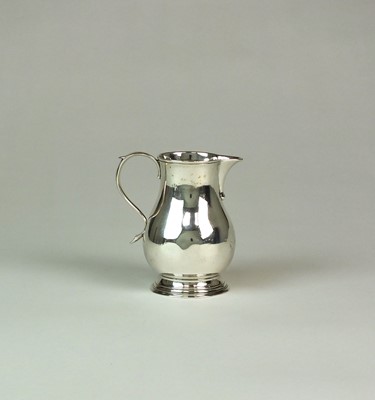 Lot 8 - A George II sparrow beak silver cream jug