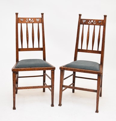 Lot 607 - A set of four Arts and Crafts style chairs