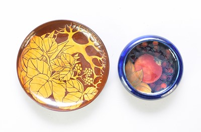 Lot 350 - A Moorcroft dish and Cirencester Pottery slipware saucer