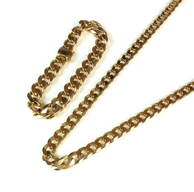 Lot 91 - A 9ct gold flat curb link necklace and a yellow metal matching bracelet