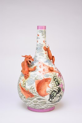 Lot A large Chinese famille rose relief moulded bottle vase
